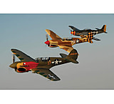 Image of iCanvas Two P-40 Warhawks And A P-51D Mustang Flying Over Chino, Cal by Stocktrek Images - Canvas Print