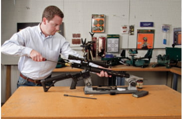 Image of Man Using a Bore Brush on an AR15