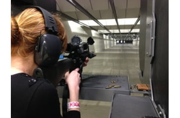 Image of Woman Practicing in Indoor Shooting Range
