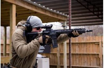 Image of Ma Shooting AR 15 with ACOG Scope