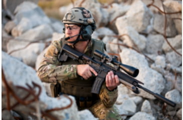 Image of Man in Military Gear with a Suppressor on his Rifle