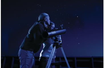 Image of Two People Using a Telescope at Night