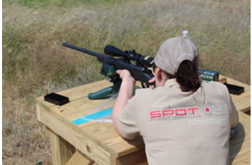Image of Woman shooting a rifle at a long-distance shooting range
