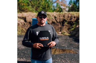 Image of The Iceman holding up an armor plate in the area it's supposed to protect. 