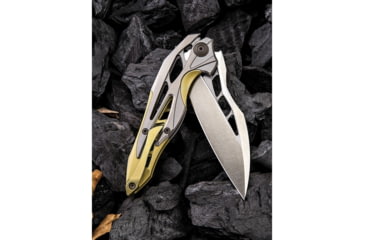 Image of We Knife Co Ltd Arrakis Framelock Folding Knife, 4.5in Closed, 3.5in Satin Bohler M390 SS Blade, Gold And Silver Titanium Handle, Pocket Clip, Black Nylon Zippered Storage Case, Gold and silver, 906C