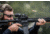 Man aiming through EOTech XPS2