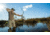 Man Bowfishing on the Water