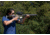 Woman Shooting Suppressed AR with Magnifier and Holographic Sight
