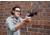 Man Shooting a Pistol at a Target Range