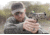 Man Shooting Pistol with Red Dot Sight