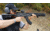 Man Shouldering Rifle and Aiming