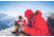 Two People Wearing Cold Weather Gear on a Mountain