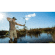 Man Bowfishing on the Water