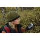 Woman Using GPS Device in the Woods