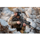 Man in Military Gear with a Suppressor on his Rifle