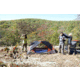 3 People on a Ridge with a Camping Tent