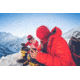 Two People Wearing Cold Weather Gear on a Mountain