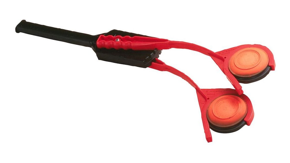 A handheld clay disc thrower. 