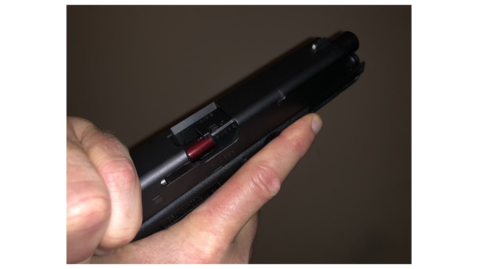 Chamber check with an overhand grip on the slide. 