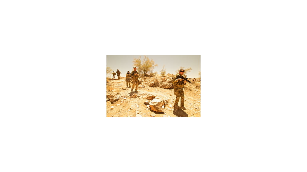 Squad of Operators Wearing Chest Rigs and Camo with Rifles
