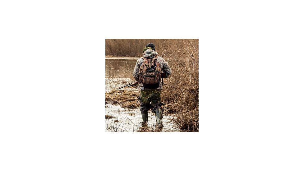 Waterfowl hunter in marshes.