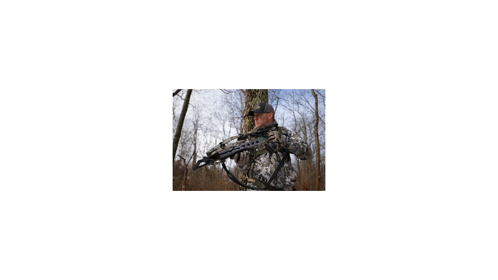 Man dressed in camo hunting gear with a crossbow