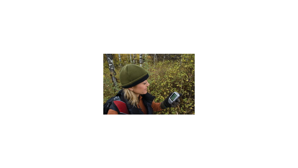 Woman Using GPS Device in the Woods