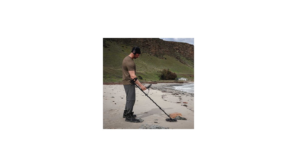 Man Using Minelab Equinox 900 Metal Detector on Beach