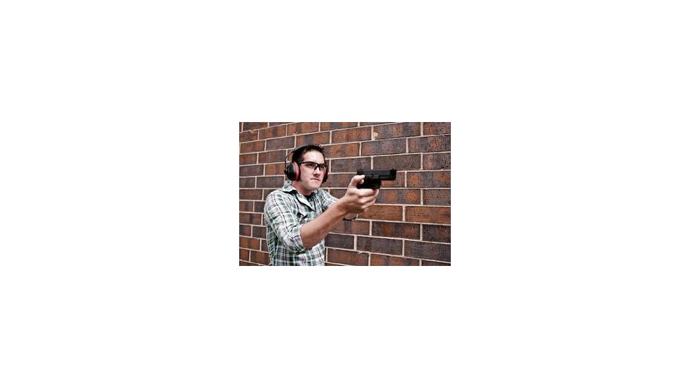 Man Shooting a Pistol at a Target Range