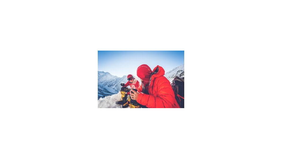 Two People Wearing Cold Weather Gear on a Mountain