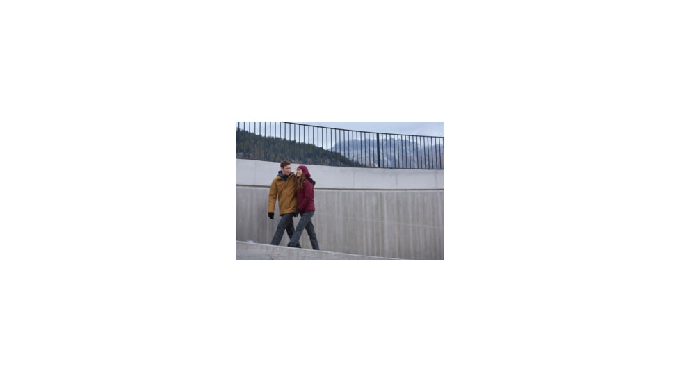 Man and Woman Walking and Wearing Winter Jackets