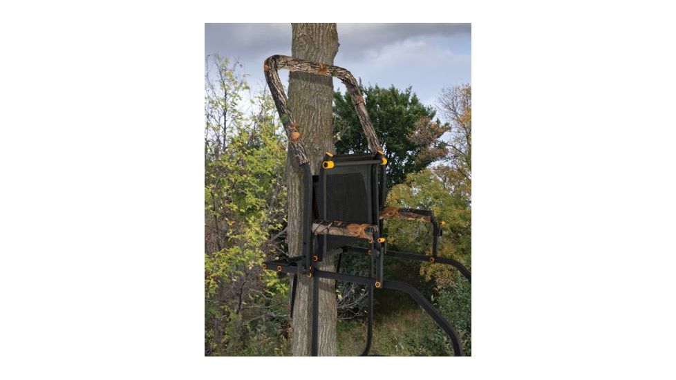 Muddy Skybox Ladderstand, includes 1-1in Ratchet Strap, 2-1in Stabilizer Straps, Adjustable Support Bar, Full Body Arrest Harness, Adjustable Padded Shooting Rail that flips back., Black/Camo MLS1500