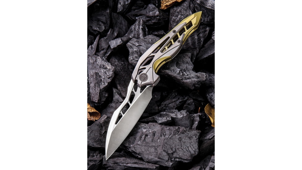 We Knife Co Ltd Arrakis Framelock Folding Knife, 4.5in Closed, 3.5in Satin Bohler M390 SS Blade, Gold And Silver Titanium Handle, Pocket Clip, Black Nylon Zippered Storage Case, Gold and silver, 906C